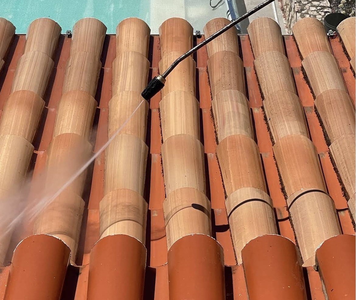 Roof cleaning in progress